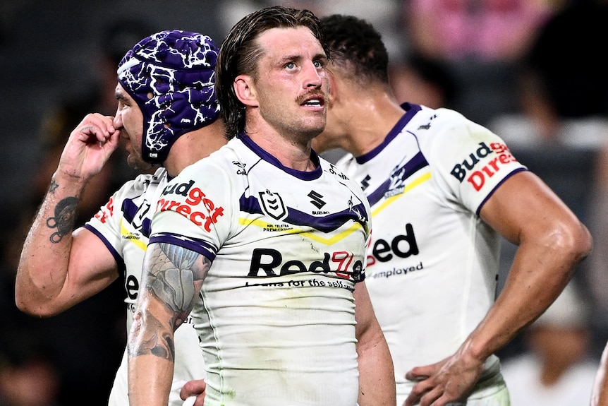 Cameron Munster and Storm teammates re-group during their NRL loss to the Panthers.