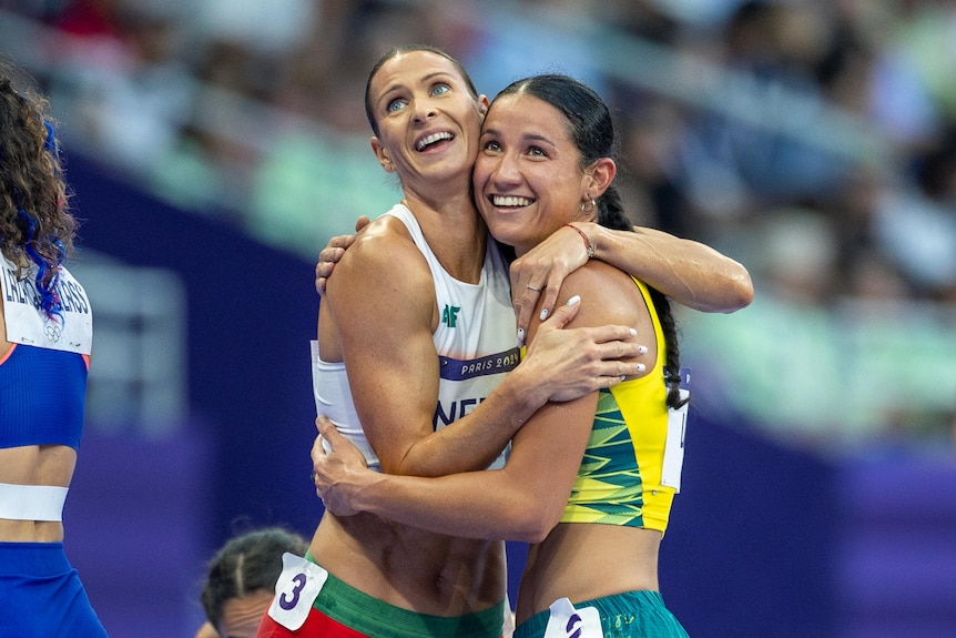 Heptathletes Rita Nemes and Tori West hug at the 2024 Paris Olympics.