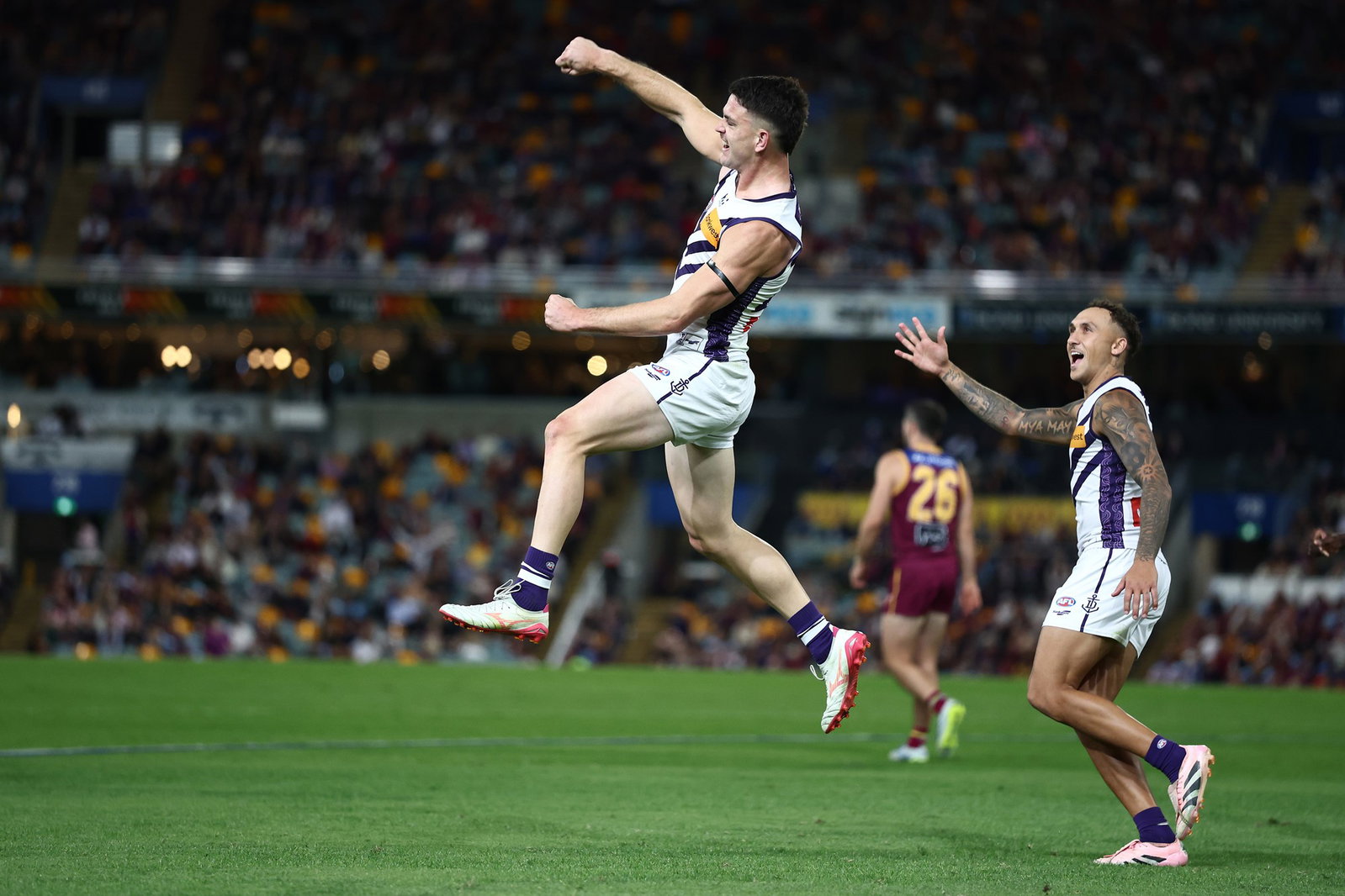 Patrick Voss of the Dockers celebrates a goal during the round 12 AFL match between Brisbane Lions and Fremantle Dockers at The Gabba, on May 30, 2026, in Brisbane, Australia.