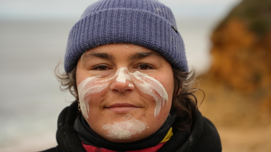 'Stand up with us and for us': Artist's passions collide at surf comp
