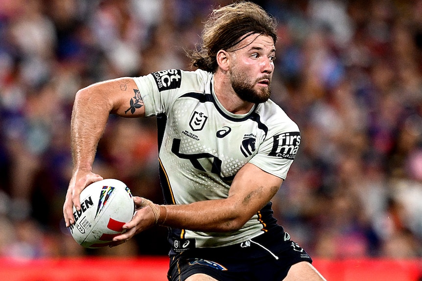 Patrick Carrigan prepares to pass the ball for the Broncos during a 2026 NRL match.