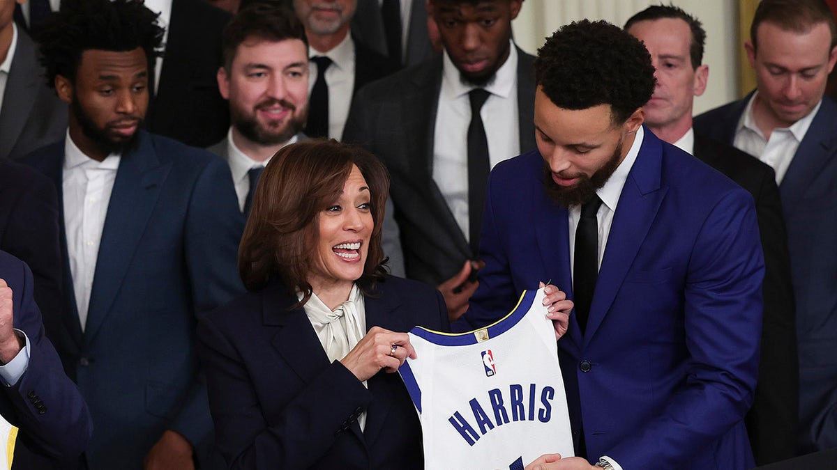 Steph Curry presenting a jersey to Vice President Kamala Harris in the White House