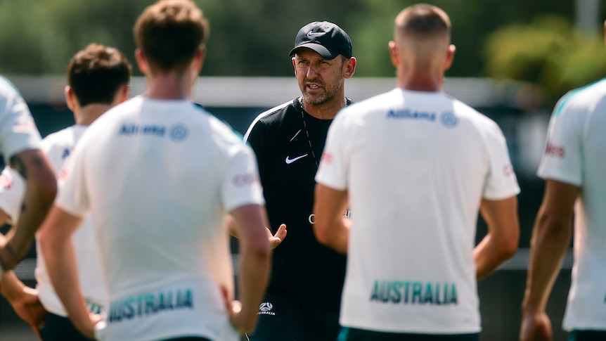 Tony Popovic addresses the Socceroos squad during a training session